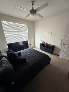 a bedroom with a bed and a ceiling fan at Cozy Comfortable Apartment in Atlanta in Atlanta