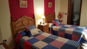 Postel nebo postele na pokoji v ubytování Apartamentos Rurales Tauro