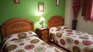 Postel nebo postele na pokoji v ubytování Apartamentos Rurales Tauro + 9 fotografií