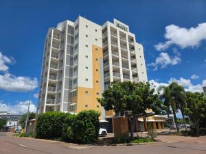 a tall building with a sign on the side of it at Quest Palmerston - Darwin in Palmerston