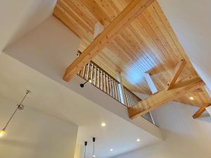 a staircase in a house with wooden beams at Private Villa 蒼 Lala & Lino in Kyotango