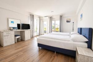 a large bedroom with a large bed and a television at Nastov Apartments in Veles