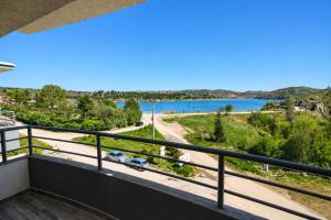 a balcony with a view of a lake at Nastov Apartments in Veles