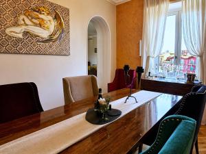 a dining room with a large wooden table and chairs at Spacious Apartment near Lake Maggiore in Luino