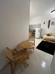 a room with a table and chairs and a kitchen at Oia seafront house in Dahab