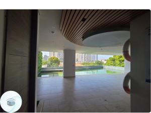 a view from the hallway of a building with a pool at Apartamento en el Rodadero, a pocos metros de la playa in Gaira