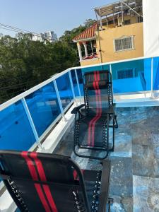 two chairs sitting on the deck of a boat at Little friend #1 Two balconies,elevator in Boca Chica