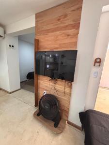 a living room with a wall with a flat screen tv at Loft in La Rioja