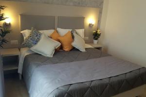 Postel nebo postele na pokoji v ubytování Hotel Luxor Florence