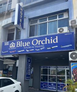 a blue orbital sign on the front of a building at Hotel Blue Orchid in Bayan Lepas +18 photos