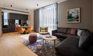 a living room with a couch and a table at The Howey in Melbourne
