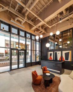 a lobby of a building with couches and a table at Apex Executive Apartments - The Ironworks in Dublin +18 photos