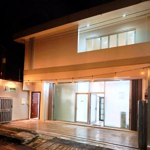 a large building with glass doors on the side of it at Bo-Box Guesthouse & Female Only Capsule Lempuyangan - Khusus Wanita in Yogyakarta