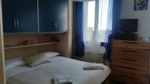 Postel nebo postele na pokoji v ubytování B&B Ariadamare