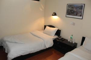 Letto o letti in una camera di Hotel Buddha Land