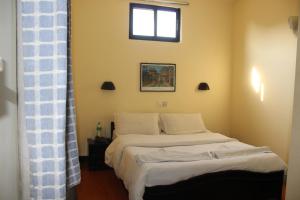 Letto o letti in una camera di Hotel Buddha Land