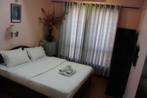 Letto o letti in una camera di Hotel Buddha Land