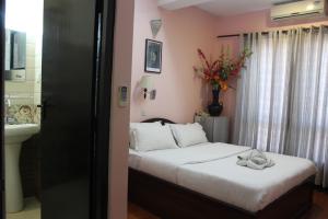 Letto o letti in una camera di Hotel Buddha Land
