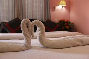 Letto o letti in una camera di Hotel Buddha Land