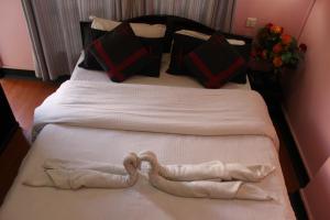 Letto o letti in una camera di Hotel Buddha Land