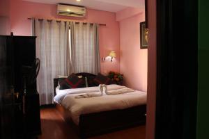 Letto o letti in una camera di Hotel Buddha Land