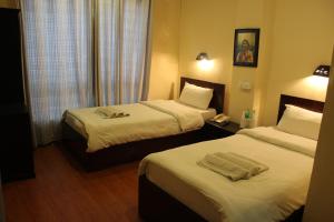 Letto o letti in una camera di Hotel Buddha Land