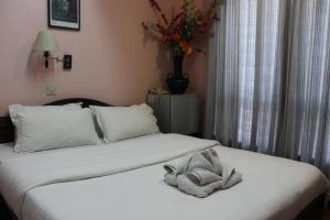 Letto o letti in una camera di Hotel Buddha Land