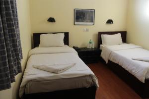 Letto o letti in una camera di Hotel Buddha Land