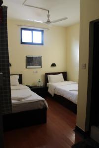 Letto o letti in una camera di Hotel Buddha Land