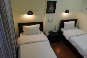 Letto o letti in una camera di Hotel Buddha Land