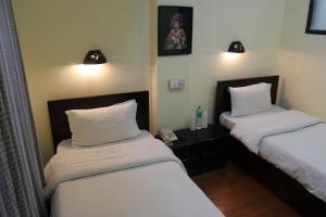 Letto o letti in una camera di Hotel Buddha Land