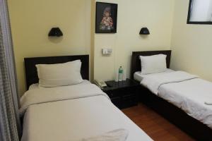 Letto o letti in una camera di Hotel Buddha Land