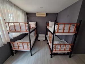a room with three bunk beds in it at Dilmac Hotel in Gelibolu +239 photos