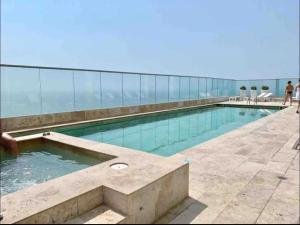 a swimming pool on top of a building at Large 3BR Apt with beautiful ocean views in Cartagena de Indias