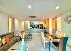 a living room with a couch and a table at Large 3BR Apt with beautiful ocean views in Cartagena de Indias