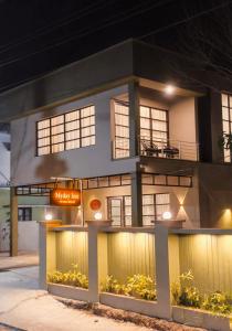 a building with a sign in front of it at Myday Inn by Znormhomes in Varkala +17 photos