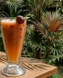 a drink in a glass sitting on a table at Lunara Sanctuary in Induruwa +22 photos