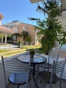 a table and chairs sitting on a patio at Ajan Apartments in Ulcinj