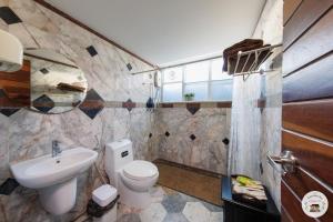 a bathroom with a toilet and a sink at Lannatika Villa in Chiang Mai +31 photos