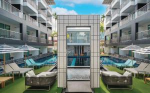 an exterior view of a building with a swimming pool at Sugar Marina Hotel - FASHION - Kata Beach in Kata Beach