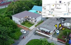 an aerial view of a building with a car parked in front at 4Hearts Hotel in Suratthani