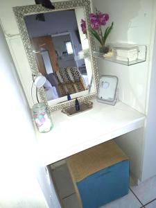 a bathroom counter with a sink and a mirror at At Lilac Cottage, Jeffreys Bay Cozy stay for 2 & Business traveling in Jeffreys Bay +52 photos