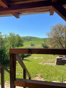 a view of a field from a wooden fence at Bedi Vendégház in Nagybakónak