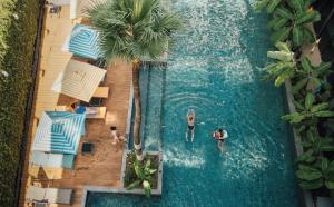 an overhead view of two people in a swimming pool at Sugar Marina Hotel-SURF-Kata Beach in Kata Beach
