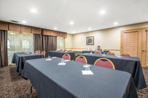a conference room with tables and chairs in it at Comfort Suites Wisconsin Dells Area in Portage +45 photos