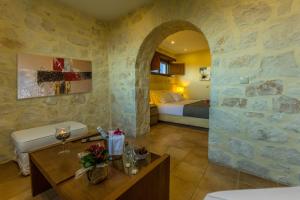 A bed or beds in a room at Exensian Villas & Suites