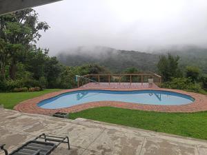 a swimming pool with a view of a mountain at Chickpea Villa in Bergview +4 photos