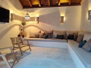 a living room with a couch and a chair at Villa Maranta in Slano