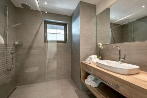 a bathroom with a sink and a shower at Panorama Apart Weisses Rössl in Reith bei Seefeld +45 photos
