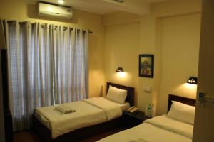 Letto o letti in una camera di Hotel Buddha Land